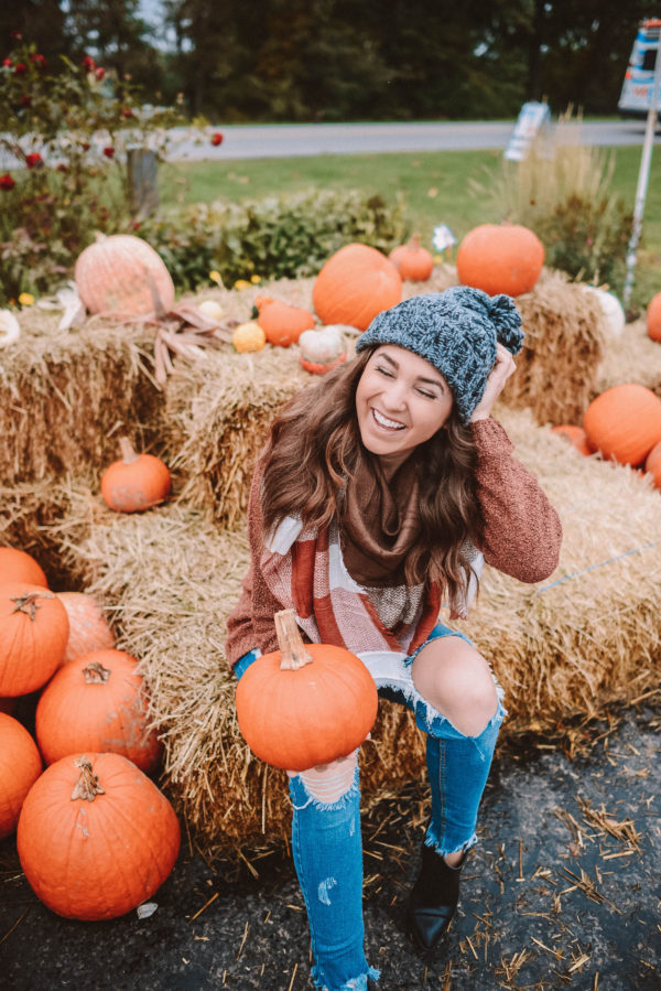 The Emily Edition Pumpkin Farm Young woman holding pumpkin